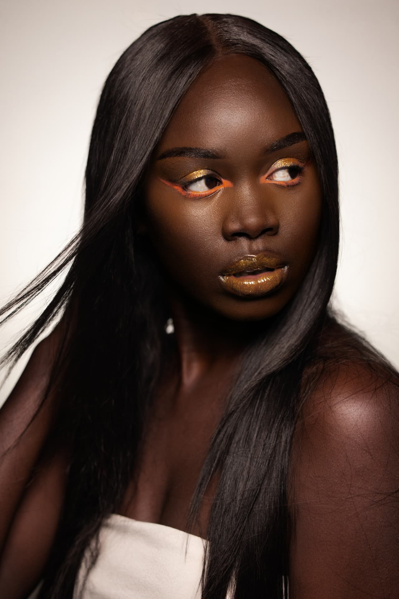 Gold lip and orange liner editorial look