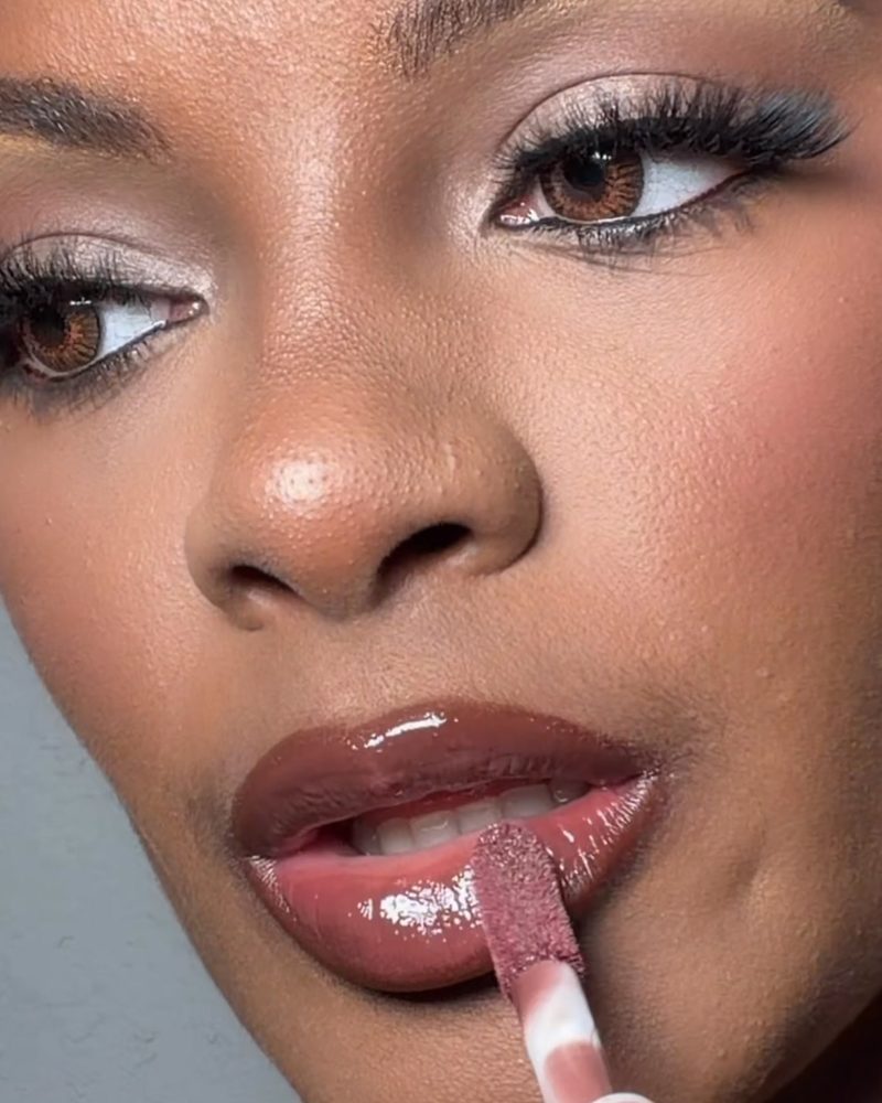 Close-up of Thee Rich Girls lip gloss being applied